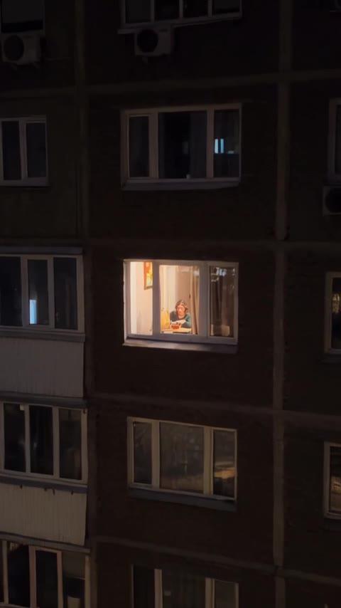 A view toward a lit window.
