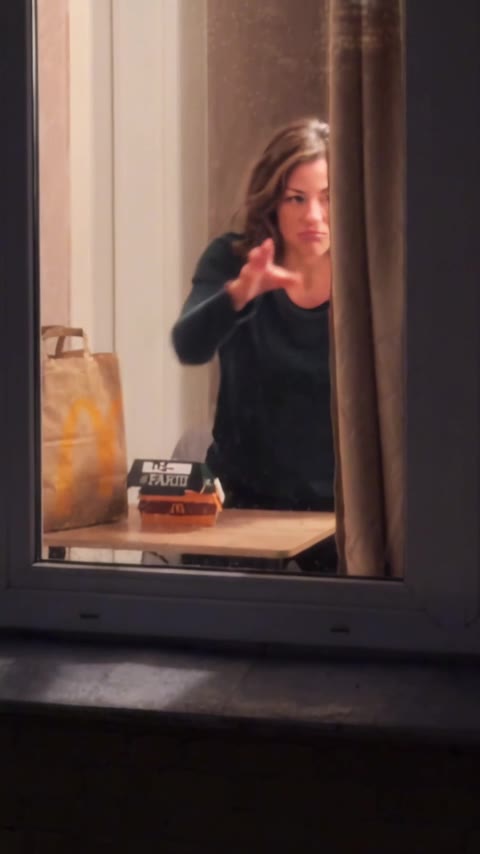 The curtain closes the shot.